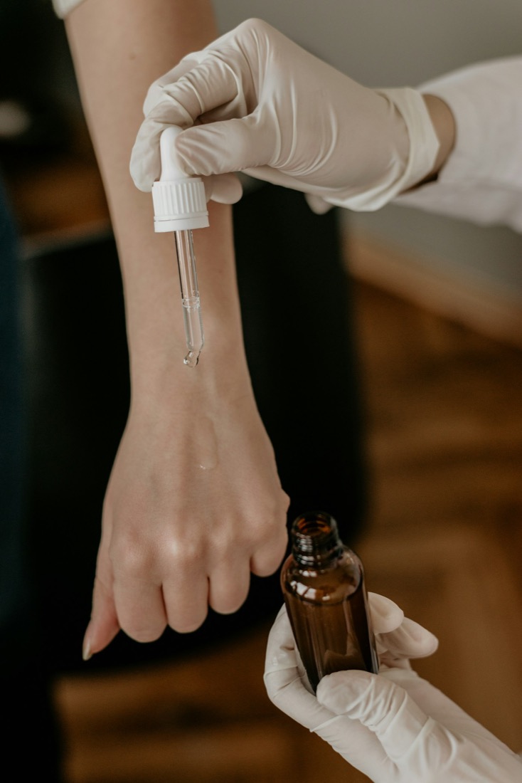 Dermatologist applying topical treatment